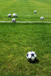 white ball on football soccer turf field green grass background