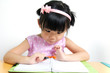 Kid is looking at book surprisingly