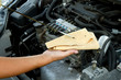 Photo: Auto mechanic checking oil Auto mechanic checking oil