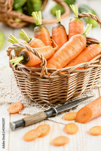 Photo: Fresh carrot in the basket Fresh carrot in the basket