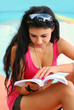 young beautiful girl reading a book