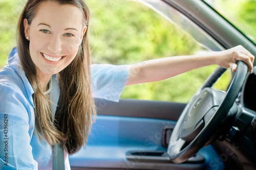 Photo: woman driving a car woman driving a car
