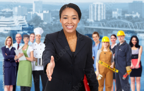 Photo: Business woman and Group of industrial workers. Business woman and Group of industrial workers.