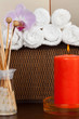 Foto: Spa still life with essential oil,candle and towel Spa still life with essential oil,candle and towel