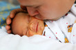 Photo: Father kissing baby Father kissing baby