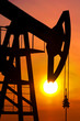 Oil pump rocker close to sunrise background