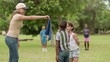Video: Children and teacher playing games in city park Children and teacher playing games in city park