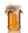 Sweet honey in jar isolated on white