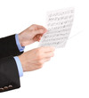 Music conductor hands with baton and notes isolated on white