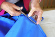 senior woman sewing