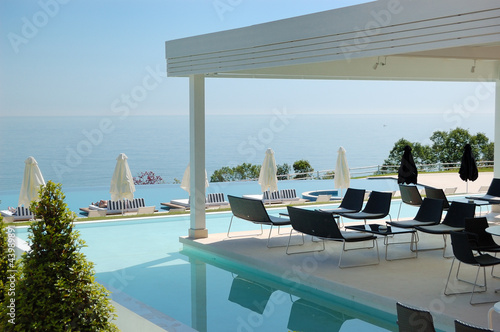 Photo: Swimming pool and outdoor restaurant at the modern luxury hotel, Swimming pool and outdoor restaurant at the modern luxury hotel,