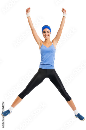 Foto : Cheerful young jumping woman, over white Cheerful young jumping woman, over white