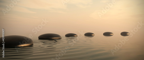 Photo: Zen path of stones on sunrise in widescreen Zen path of stones on sunrise in widescreen