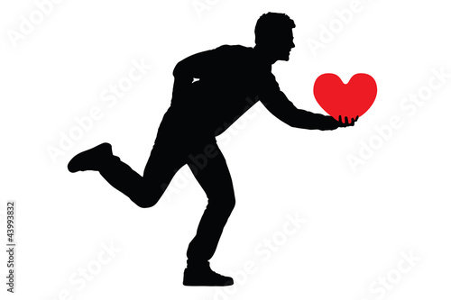 Vector: Silhouette of a man holding a red heart shaped pillow Silhouette of a man holding a red heart shaped pillow