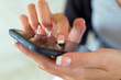 Girl hand touching screen on  smart phone