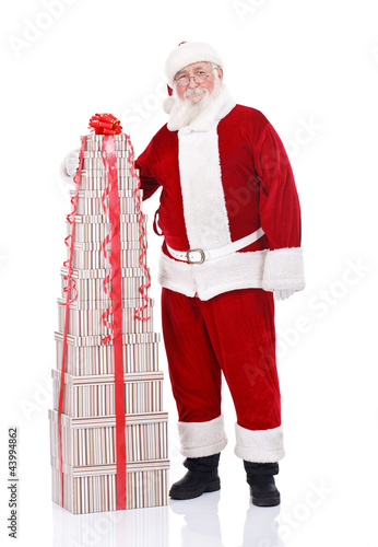 Foto: Santa with large stack of present Santa with large stack of present