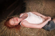 Photo: woman lying on a haystack woman lying on a haystack