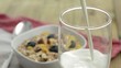 Video: Pouring Milk in a glass (with Muesli in the background) Pouring Milk in a glass (with Muesli in the background)