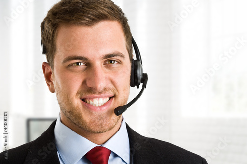 Photo: Handsome man wearing headset Handsome man wearing headset