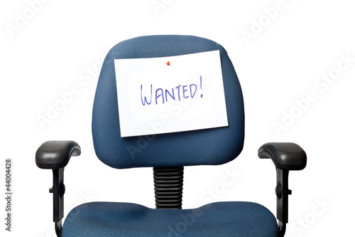 Photo: Office chair with a WANTED sign isolated on white background Office chair with a WANTED sign isolated on white background