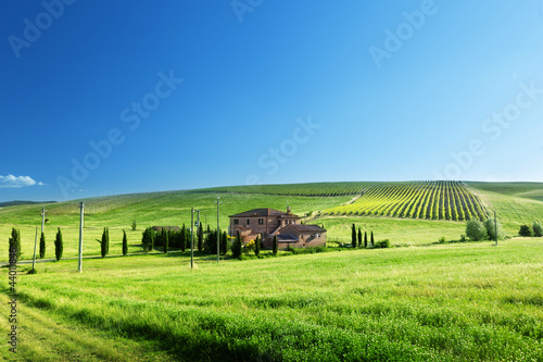 Photo: Tuscany landscape with typical farm house Tuscany landscape with typical farm house