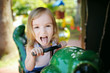 Cute little girl funny portrait outdoors