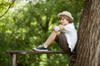 Boy sits on a bench