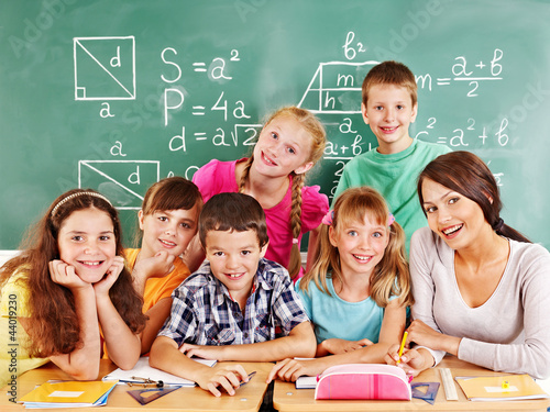 Photo: School child with teacher. School child with teacher.
