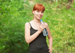 Fitness woman drinking water