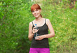 Fitness woman drinking water
