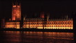 Video: Big Ben at night illuminated overlooking the Thames London, UK Big Ben at night illuminated overlooking the Thames London, UK