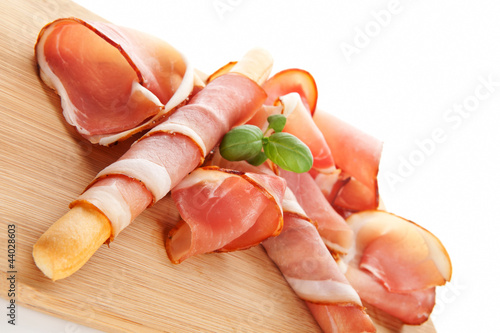 Photo: Prosciutto background. Delicious eating. Prosciutto background. Delicious eating.