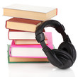Headphones on books isolated on white