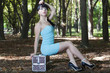 The young brunette model poses in park