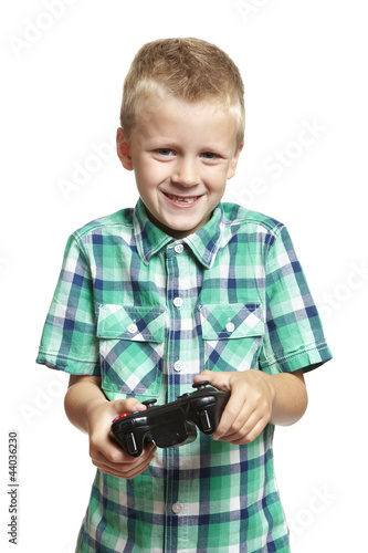 Photo: Boy playing games console Boy playing games console