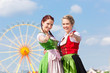 Photo: Junge Frauen in Dirndl auf Volksfest Junge Frauen in Dirndl auf Volksfest
