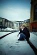 Man sitting on rail. Depression theme
