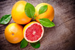 Photo: Freshly harvested grapefruit on wooden background Freshly harvested grapefruit on wooden background