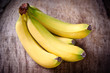 Fresh bananas on wooden background