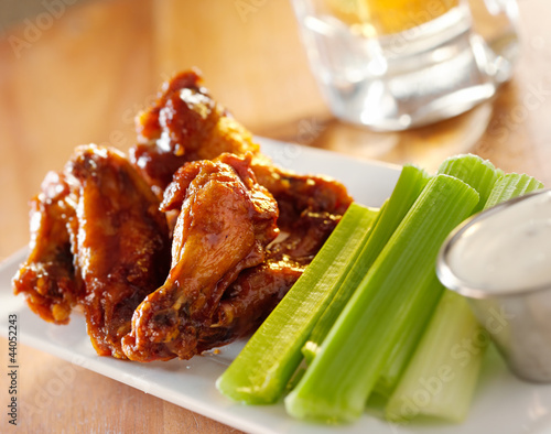 Photo: bbq buffalo wings with celery and ranch. bbq buffalo wings with celery and ranch.