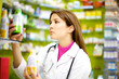 Photo: Female doctor working in pharmachy Female doctor working in pharmachy