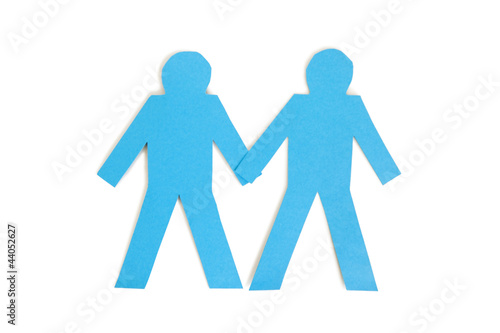 Photo: Two blue paper stick figures holding hands over white background Two blue paper stick figures holding hands over white background
