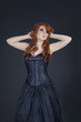 Front view of gothic teenage girl over colored background