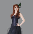 Redheaded teenage girl posing over gray background