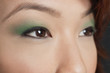 Cropped image of Asian woman looking away