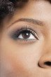 Cropped image of African American woman with eye makeup