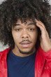 Portrait of young man with headache