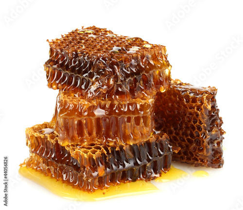 Photo: sweet honeycombs with honey, isolated on white sweet honeycombs with honey, isolated on white