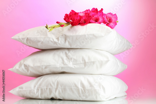 Photo: pillows and flower, on pink background pillows and flower, on pink background