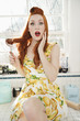 Photo: Portrait of a surprised young woman with hair tangled in whisk sitting on kitchen counter Portrait of a surprised young woman with hair tangled in whisk sitting on kitchen counter
